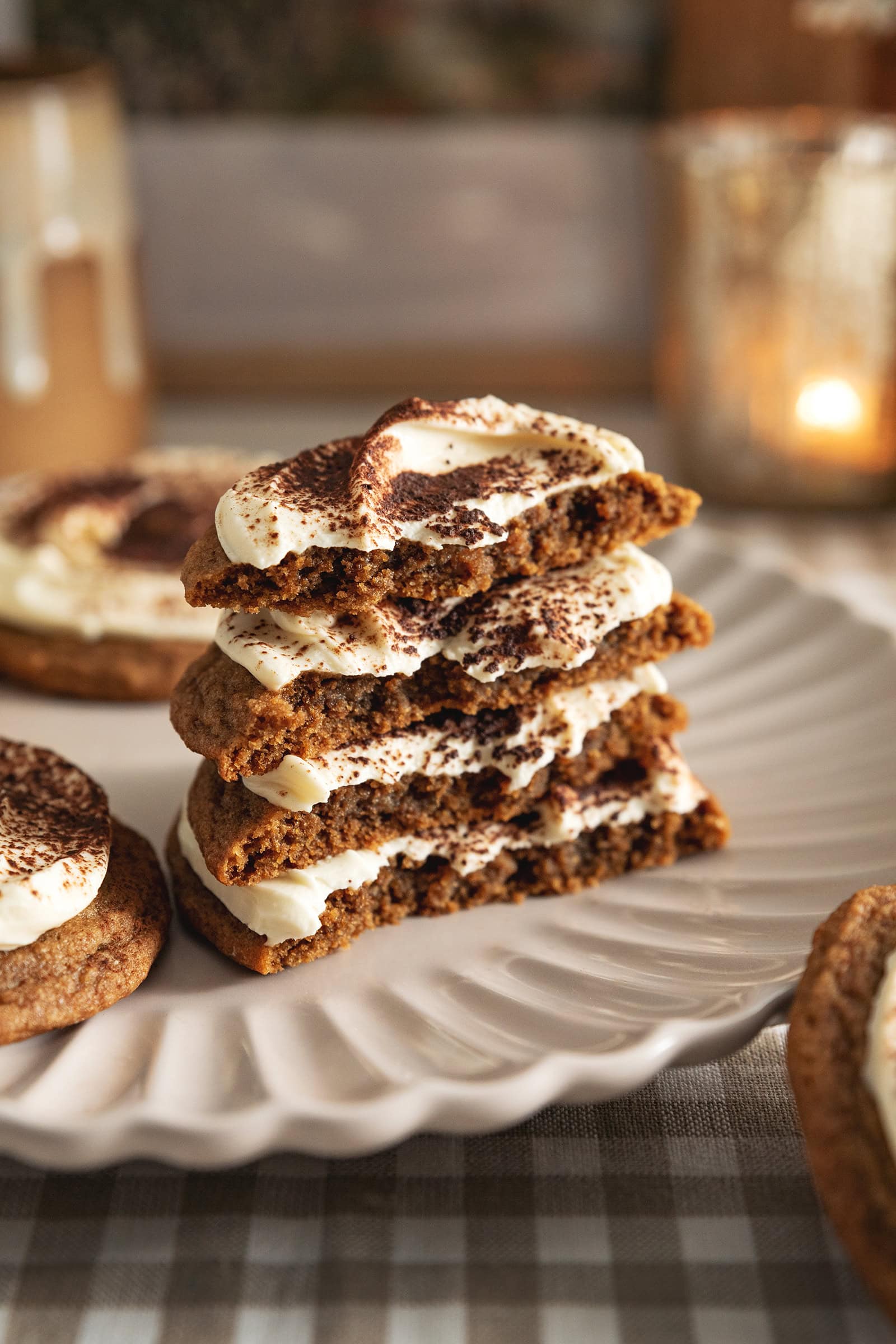 A stack of tiramisu cookies cut in half to show the texture inside.