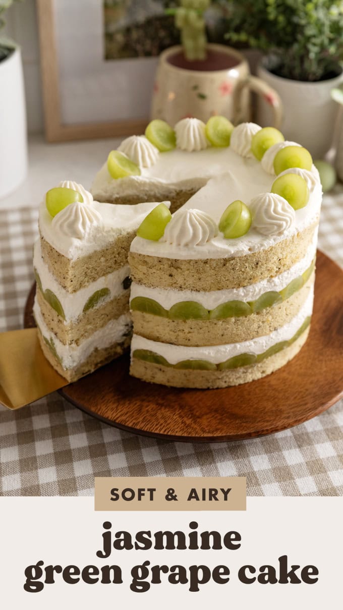 Pulling a slice of cake out of a jasmine green grape cake.