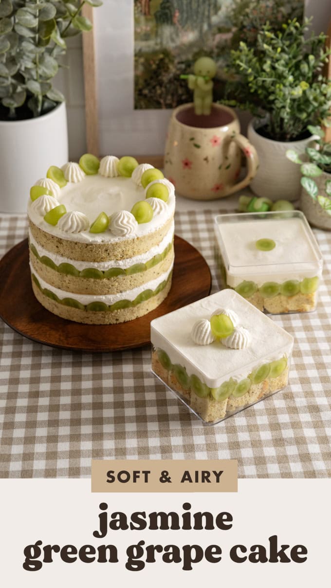 A jasmine green grape cake and two cake boxes on a kitchen counter.