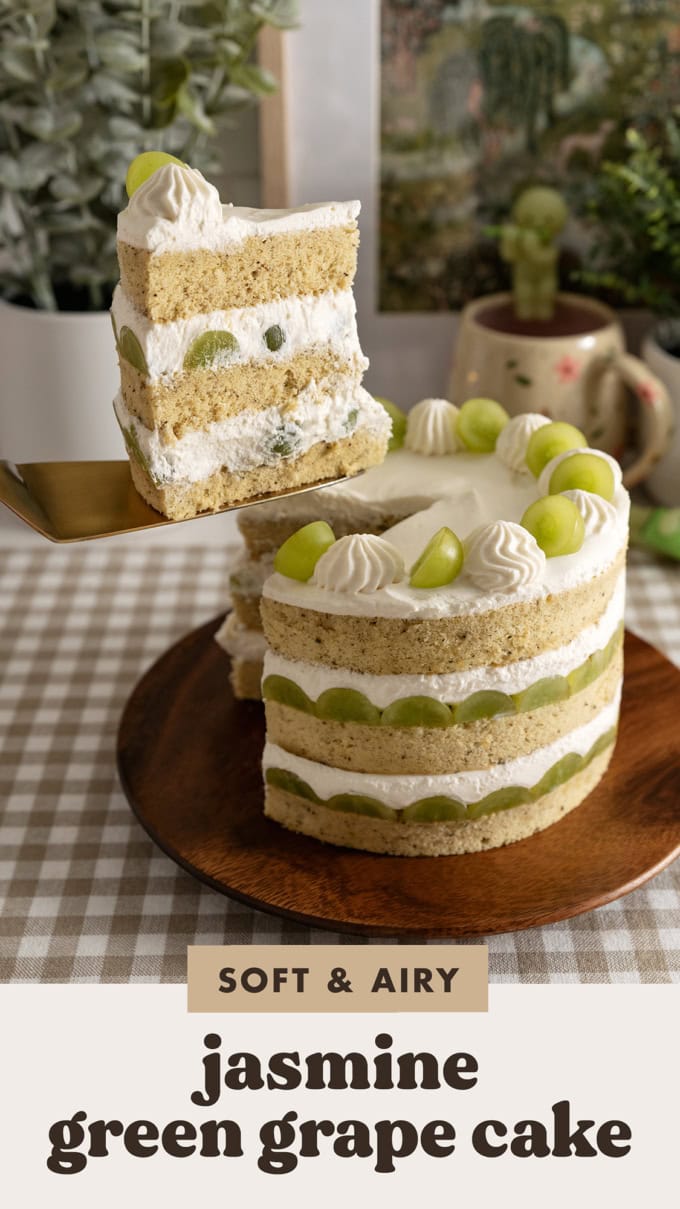 Lifting a slice of jasmine green grape cake above the rest of the cake.