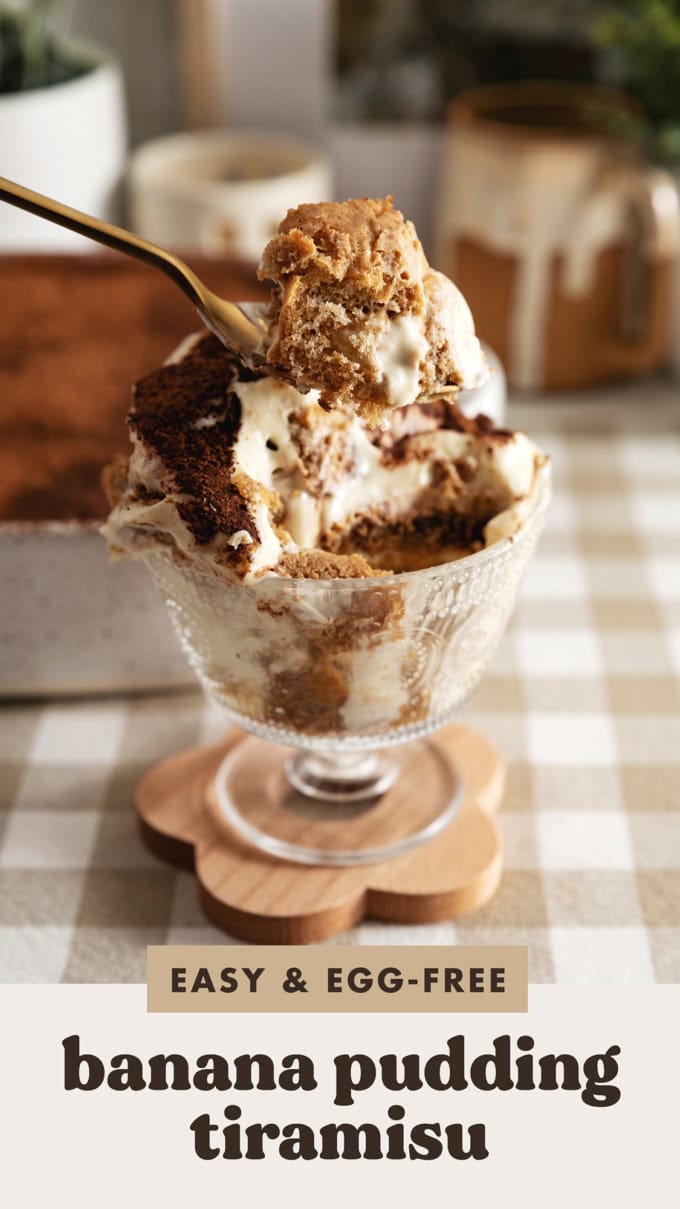 A spoonful of banana pudding tiramisu held above a bowl of tiramisu.