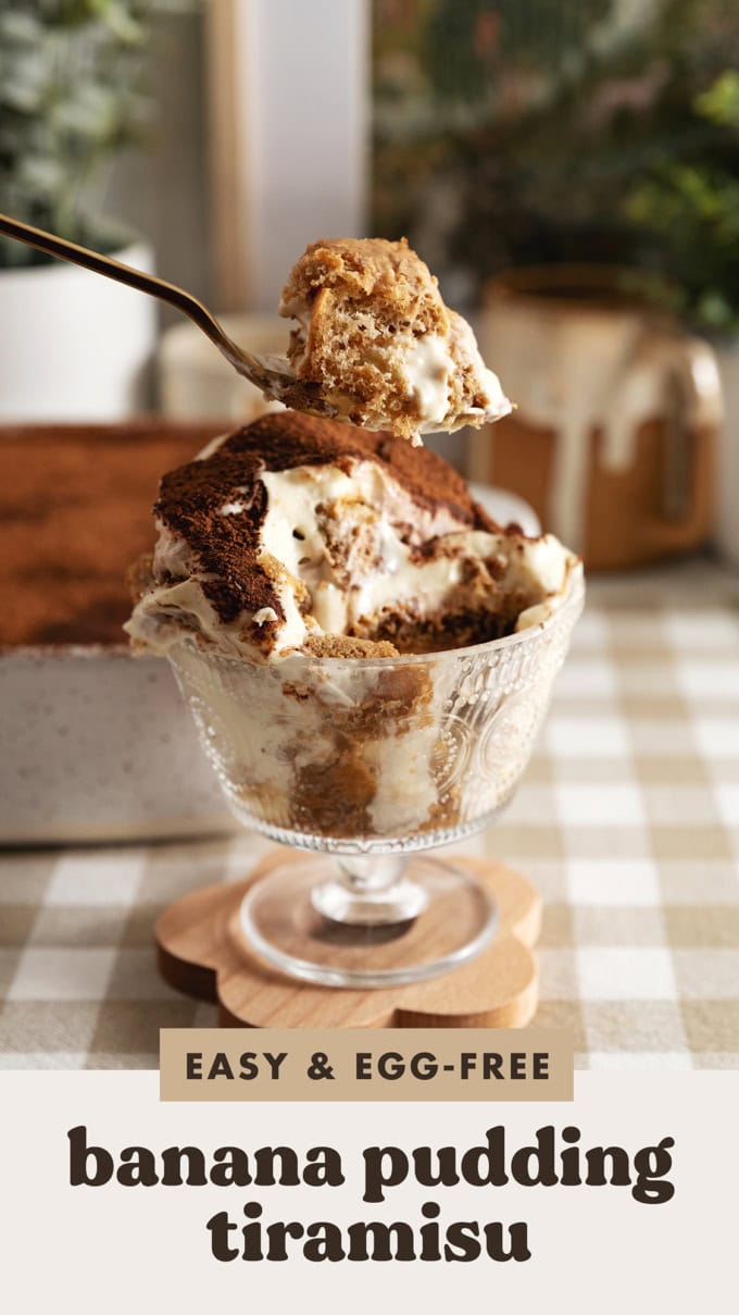 Lifting a spoonful of banana pudding tiramisu above the rest of the bowl.