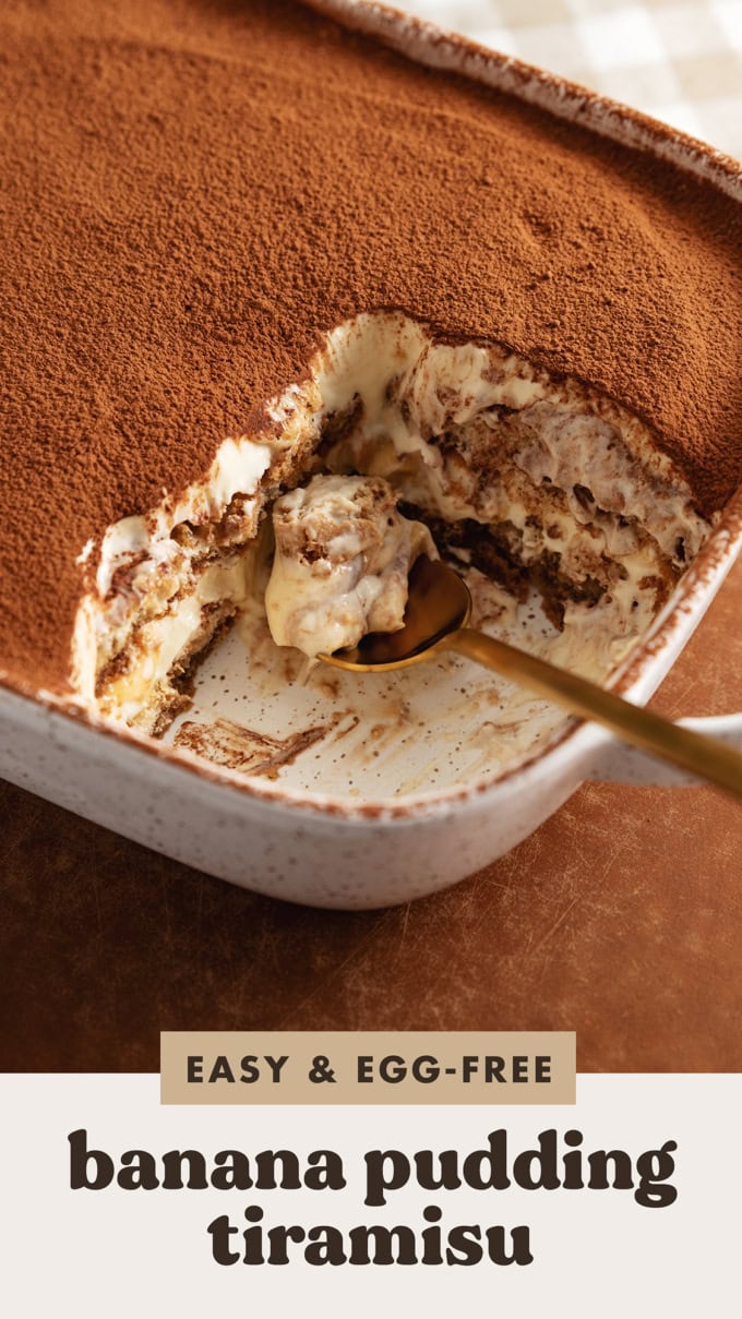 A spoonful of banana pudding tiramisu resting in a dish where the tiramisu was scooped out of.
