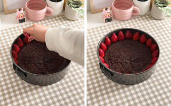 Left: hand placing a strawberry in a pan on top of chocolate cake layer. Right chocolate cake in a pan with a ring of strawberries around the edges.