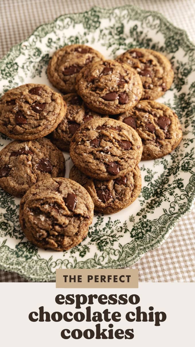 A pile of espresso chocolate chip cookies on a vintage serving platter.