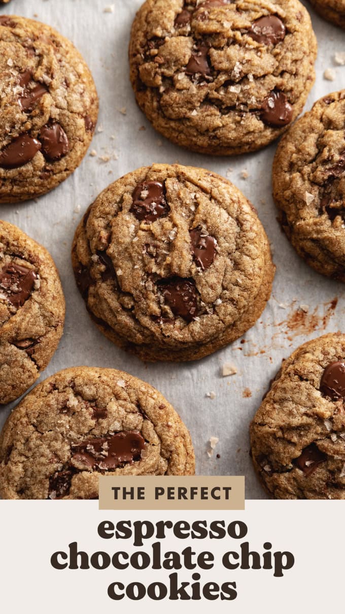 Espresso chocolate chip cookies scattered on parchment paper.