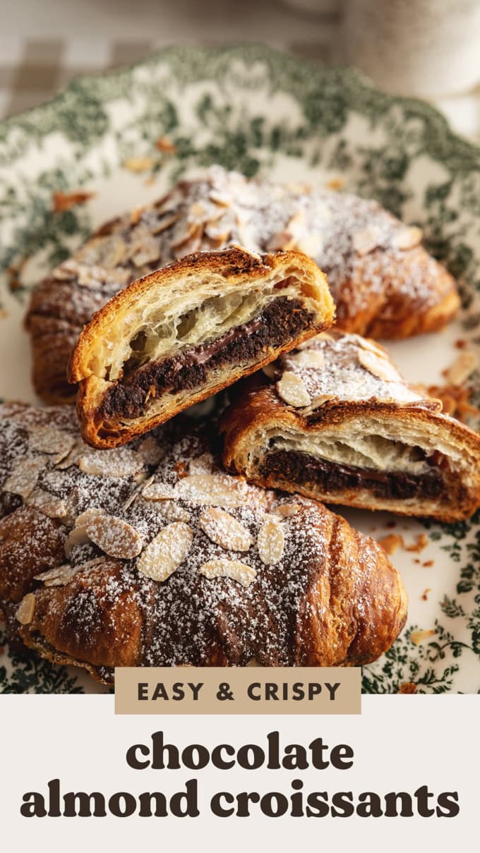 A chocolate almond croissant cut in half to show the chocolate frangipane inside.