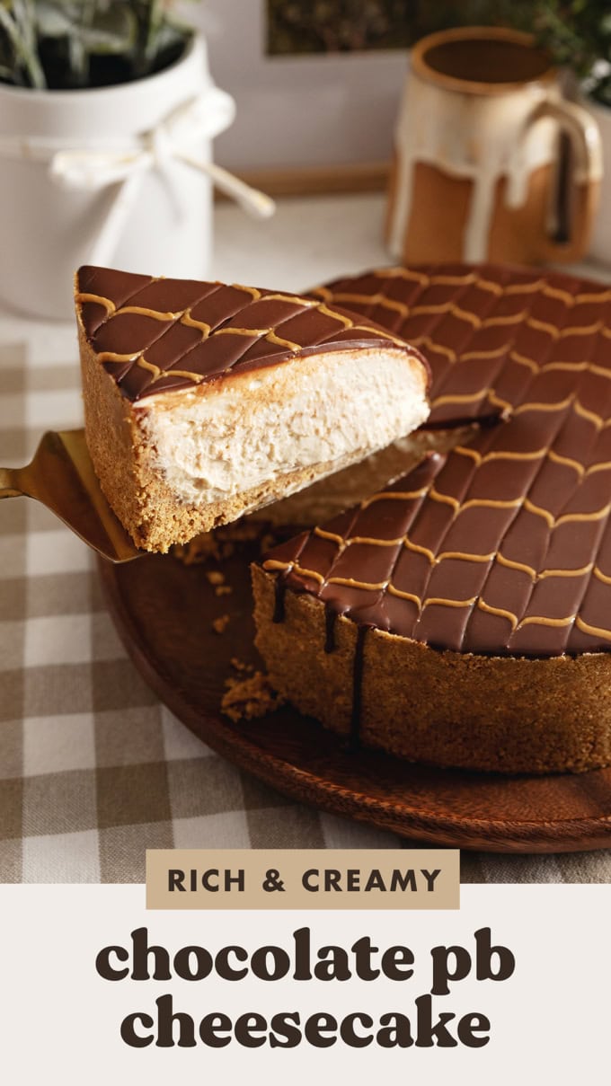 A slice of chocolate peanut butter cheesecake being lifted above the rest of the cake with a cake server.