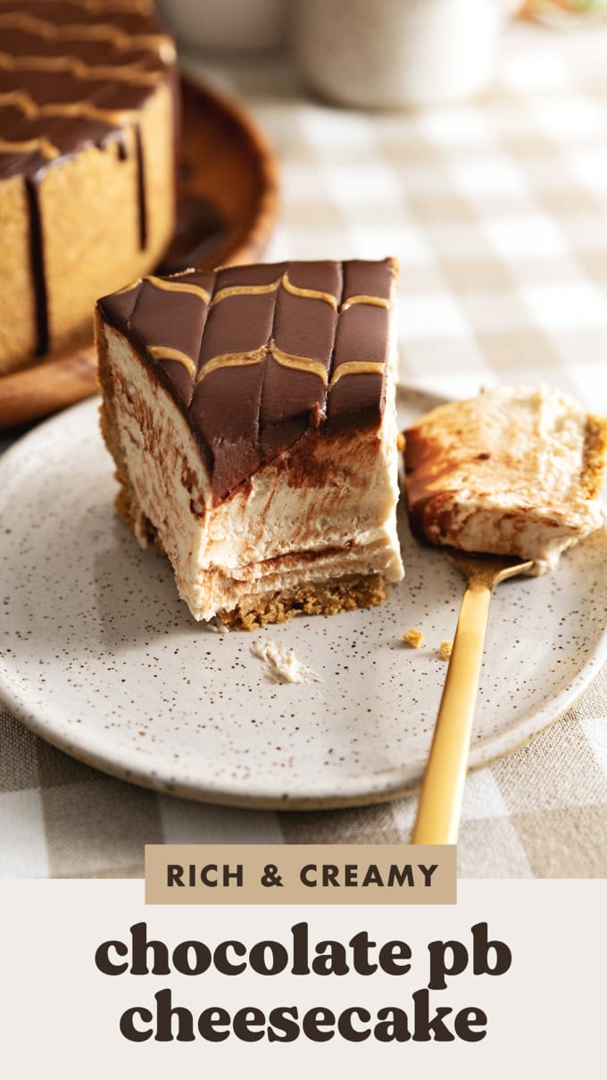 A slice of chocolate peanut butter cheesecake on a plate with a forkful of cheesecake resting next to it.
