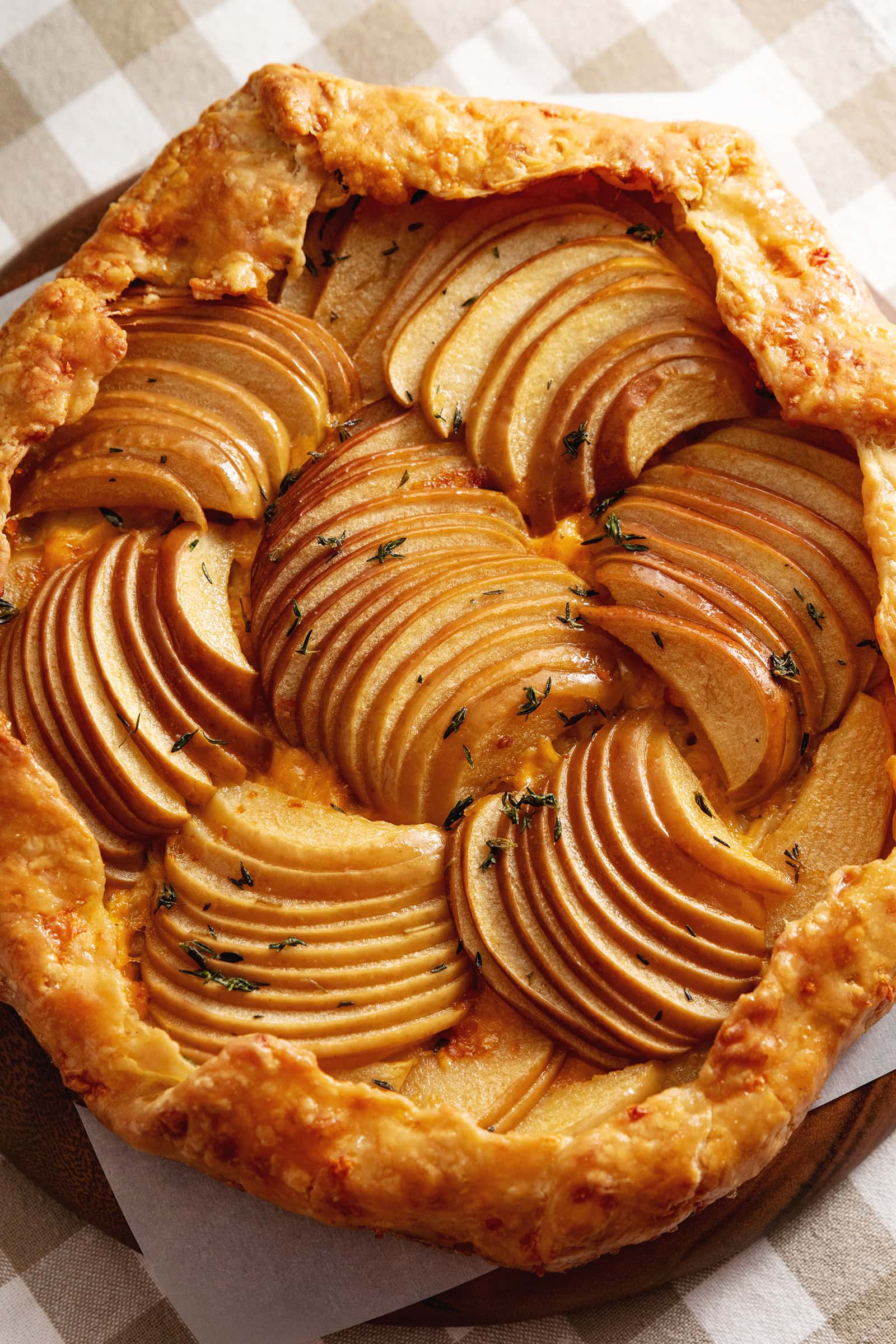 Close-up of an apple cheddar galette showing the arranged apple slices.