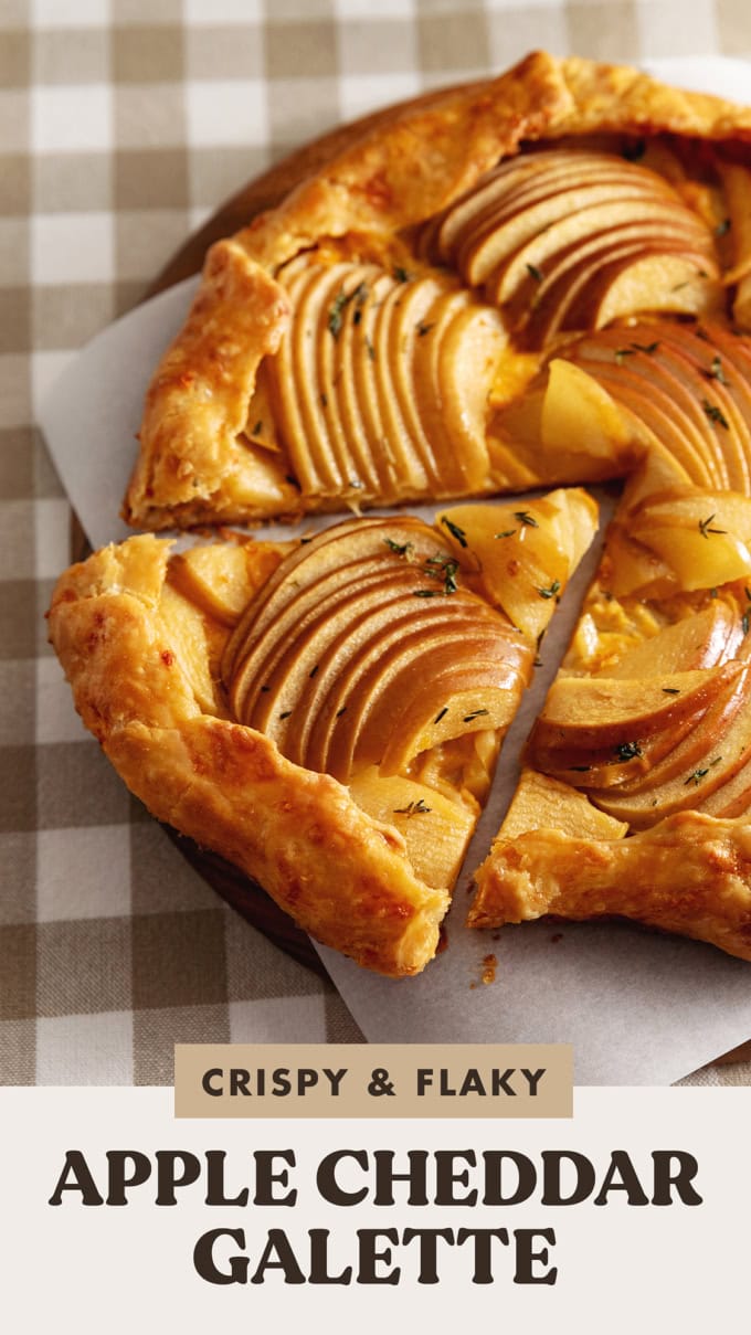 A triangular slice of an apple cheddar galette cut from the rest of the galette.