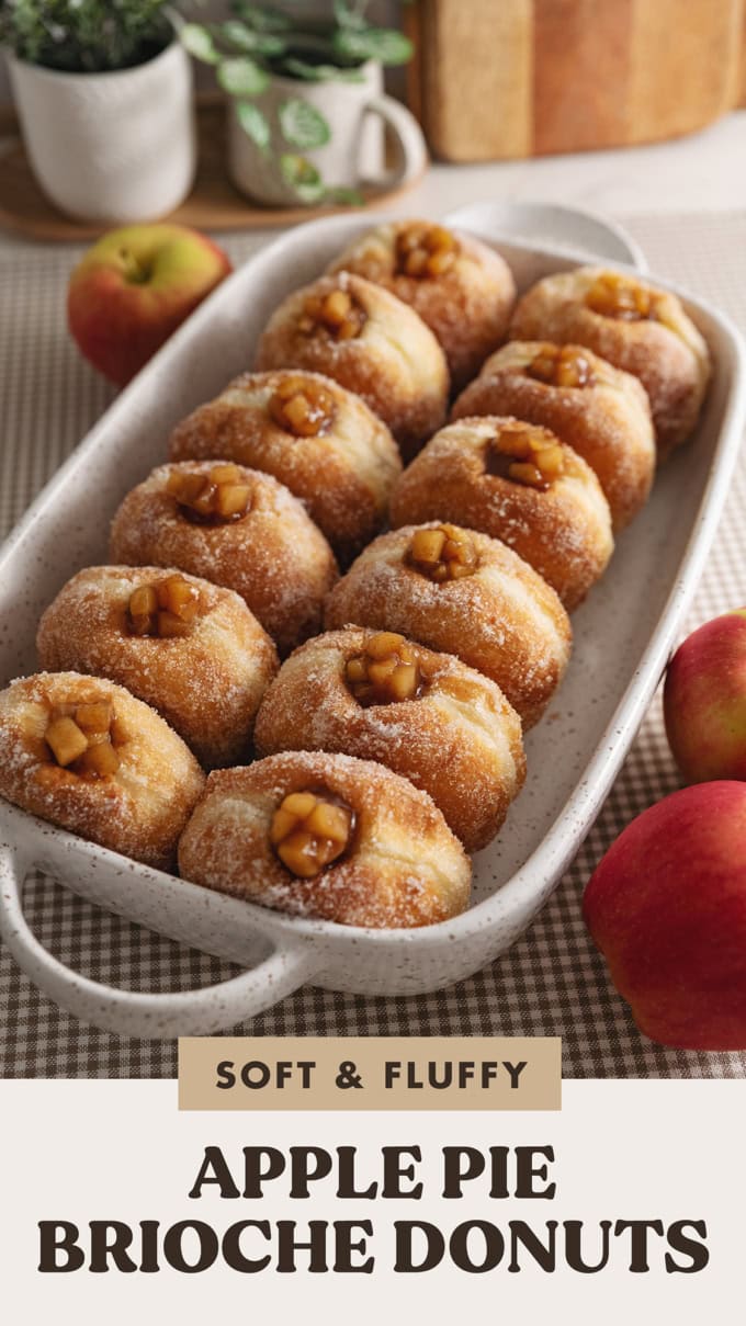 Two rows of apple pie donuts lined up in a baking dish.