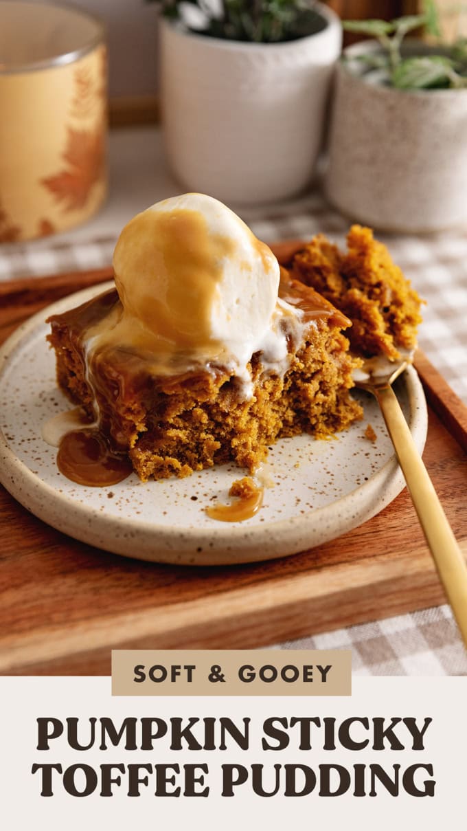 A slice of pumpkin sticky toffee pudding on a plate with a forkful taken out of it to show the cake texture.
