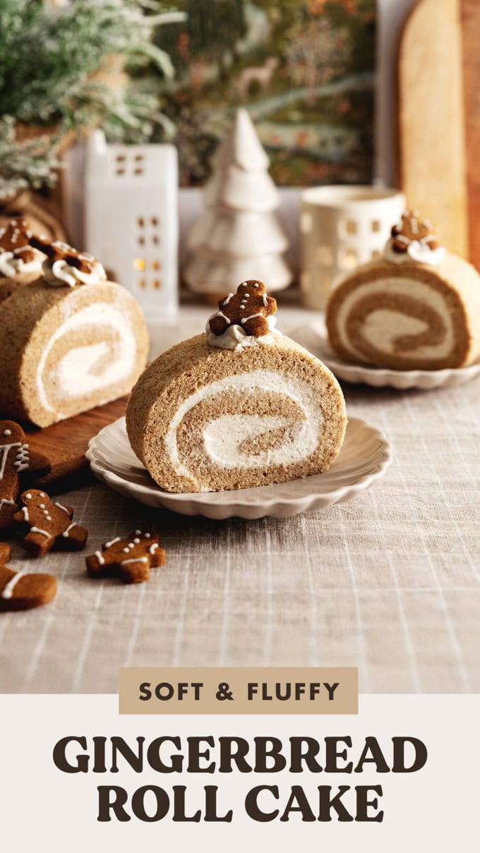 Slices of gingerbread roll cake on plates with gingerbread men cookies next to them.