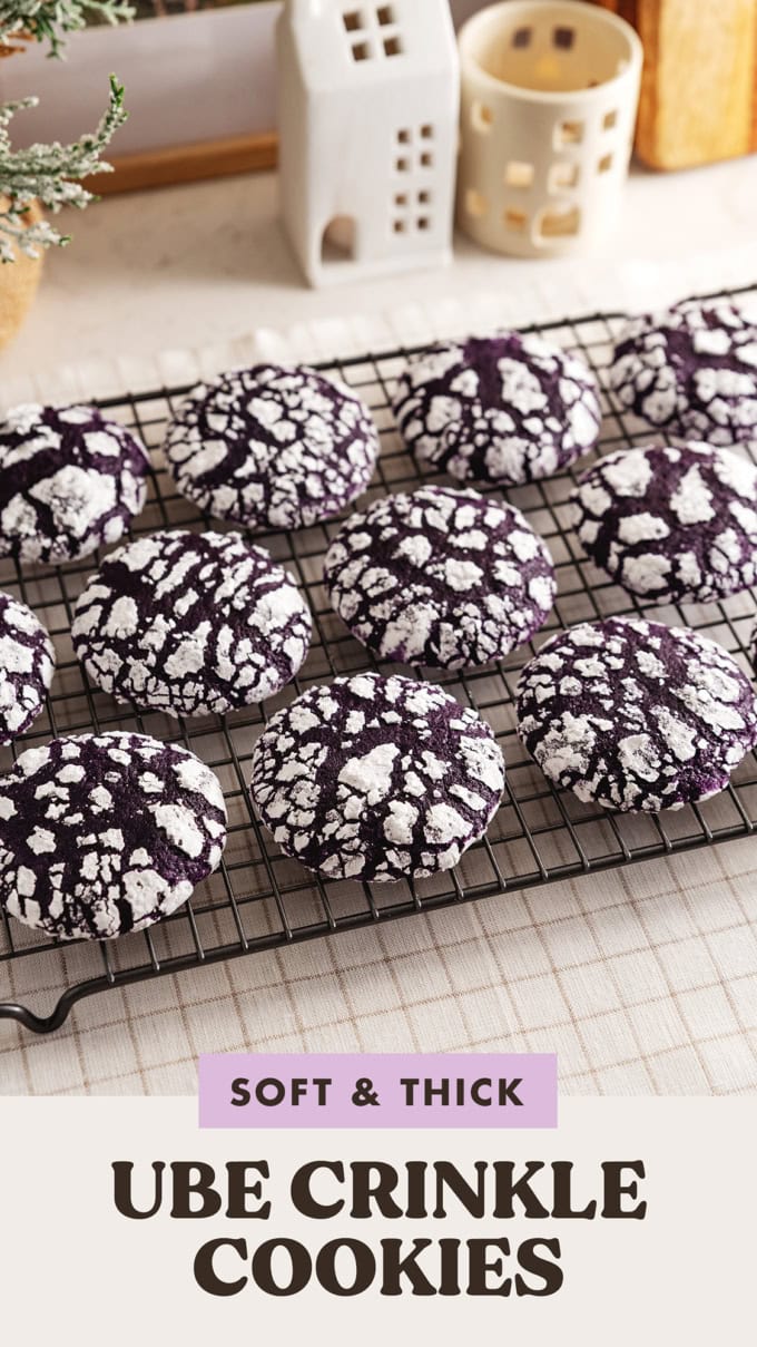 Ube crinkle cookies lined up on a wire rack.